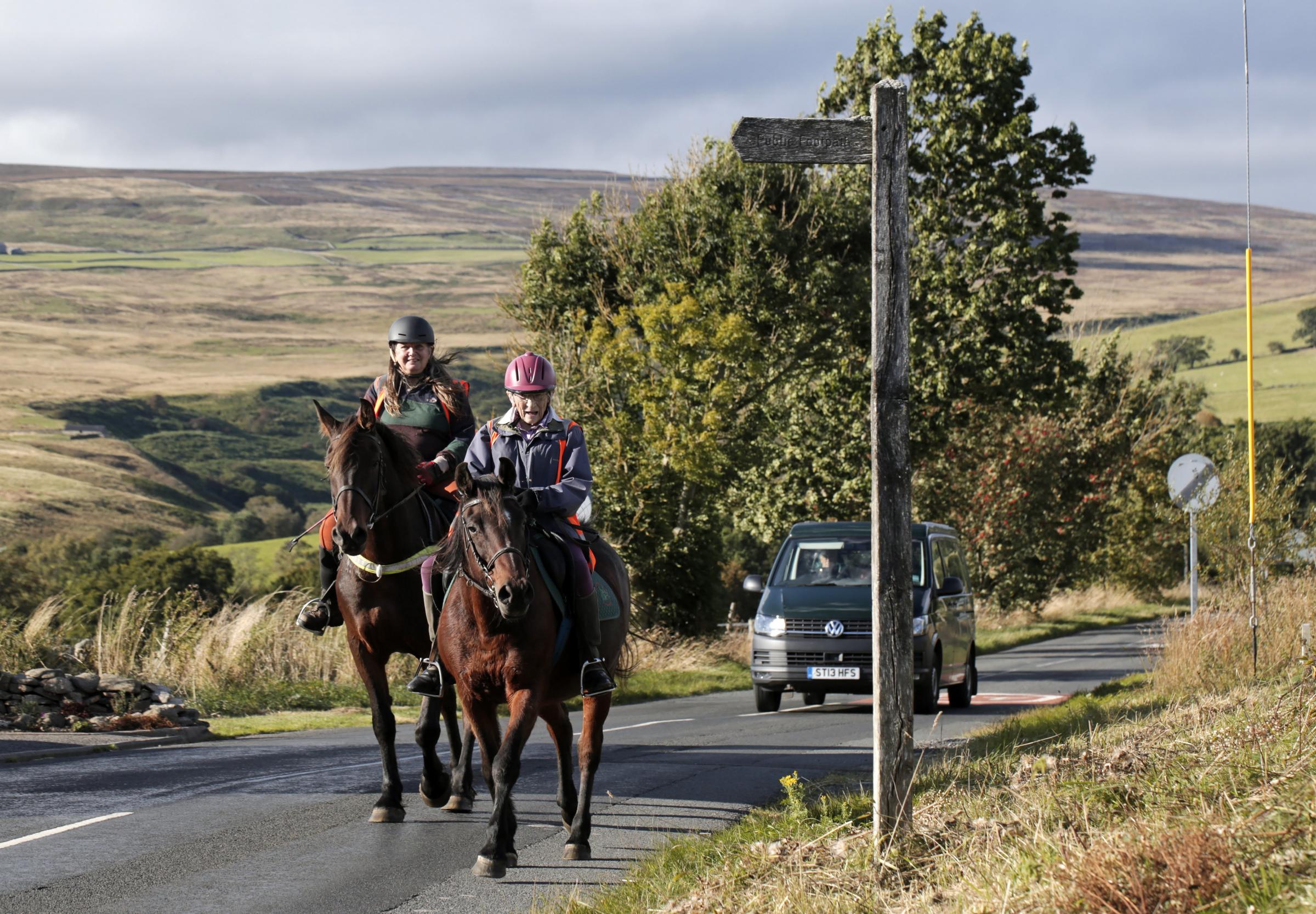 95-year-old Dr. Margaret Bradshaw and Tricia Snaith complete their sponsored trek in the village of Eggleston Picture: STUART BOULTON