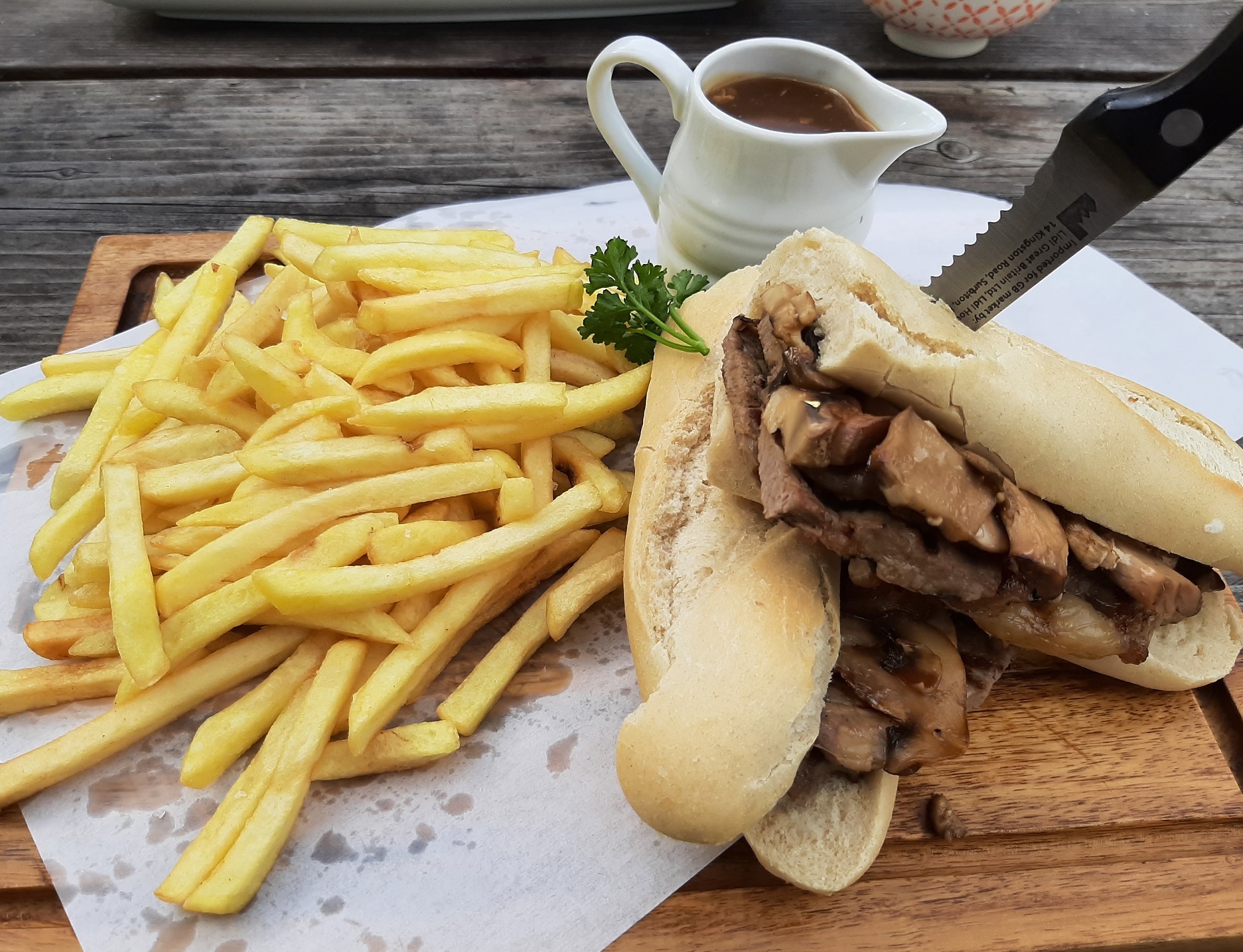 The hot steak sandwich with fries, mushrooms and gravy